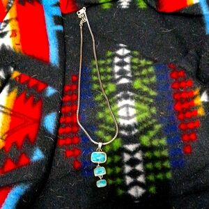 Sterling silver necklace with three turquoise stones